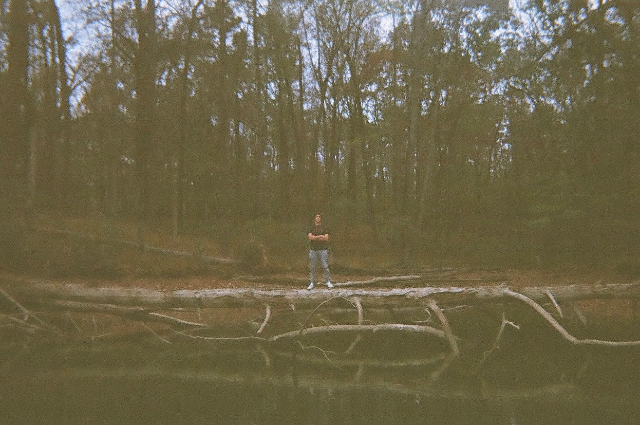 Person standing in a forest with a transparent background